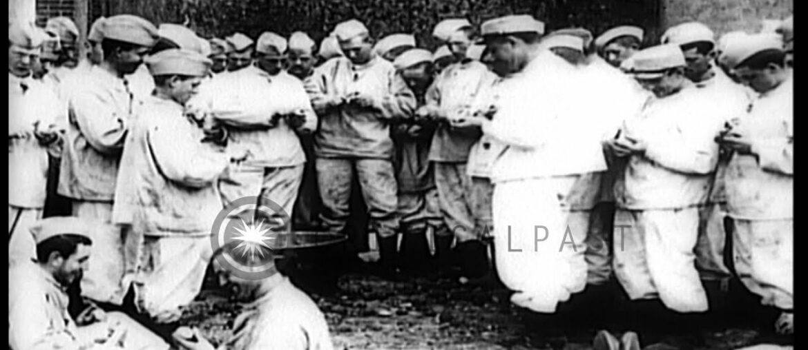 New French Army recruits peel potatoes and eat in dining hall during World War I. HD Stock Footage New French Army recruits peel potatoes and eat in dining hall during World War I. HD Stock Footage