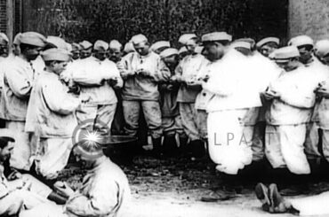 New French Army recruits peel potatoes and eat in dining hall during World War I. HD Stock Footage