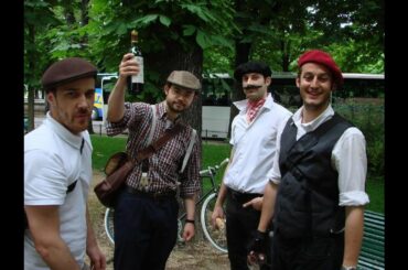 French people with their baguette, beret, wine and mustache