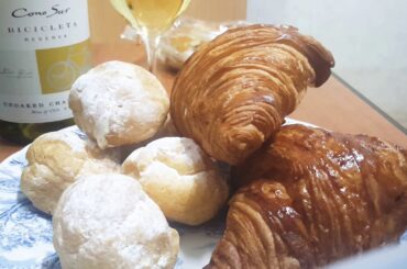 Cream puffs and croissants eat sounds with drink dry white wine