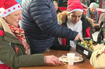 French strikers organise Christmas picnic in front of train station | AFP