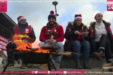French strikers organise Christmas picnic in front of train station