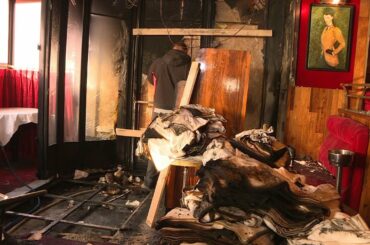 Images of fire damage at iconic Parisian brasserie frequented by Macron | AFP