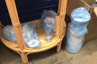 Abandoned Storage Unit of Rustic French Provincial Dining Table wall prints DVD etc at Newcomb Vic