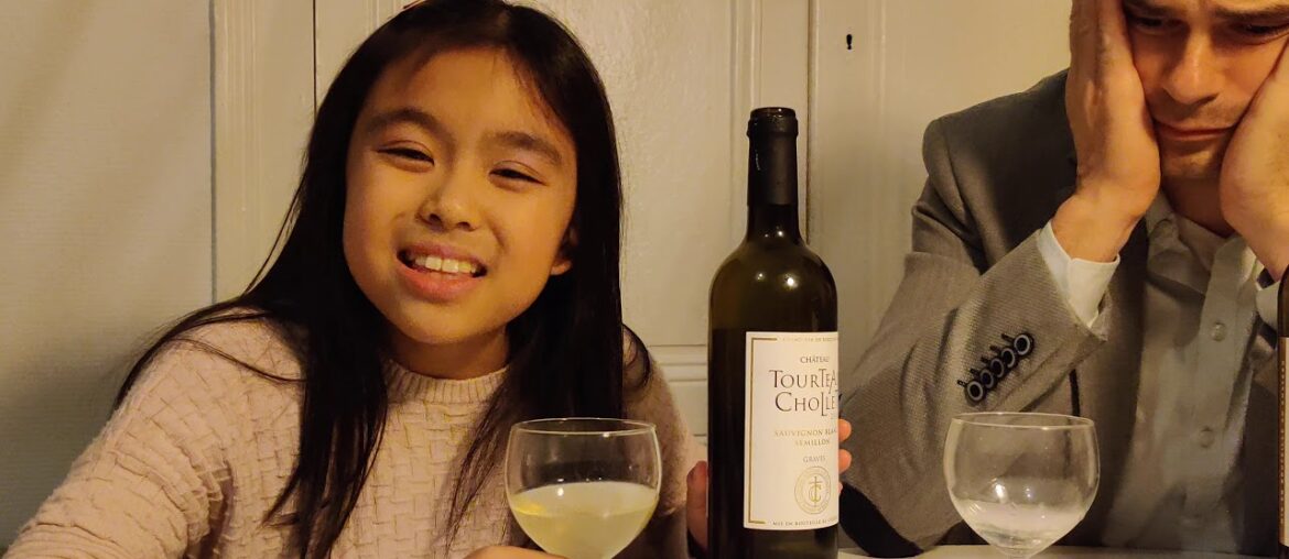 My daughter Kate tastes a white wine from Graves in Bordeaux for the first time!