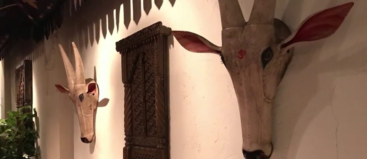 La Porte des Indes French-influenced Indian in an Edwardian ballroom with palms and a waterfall