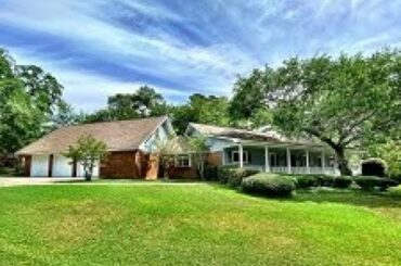 Classic Acadian Home Nestled Among Live Oak Trees!