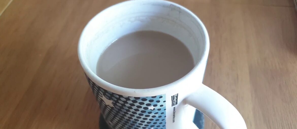 French vanilla coffee cooling in mug on dining table
