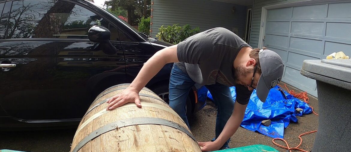 Cutting a wine barrel in half to make planters