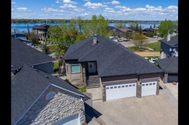 424 East Lakeview Pl.  Chestermere Alberta is a Bungalow with developed walkout & triple car garage