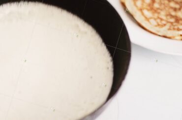 Traditional french crepe recipe on frying pan, homemade thin pancakes for breakfast, food