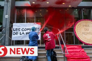 Activists douse French health ministry in red paint