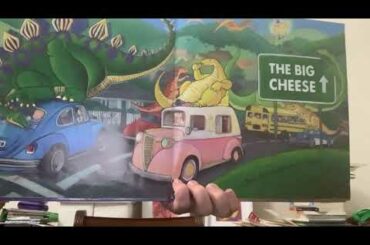 Teacher Emilie in the Dining Room Library reads DINOSAURS LOVE CHEESE