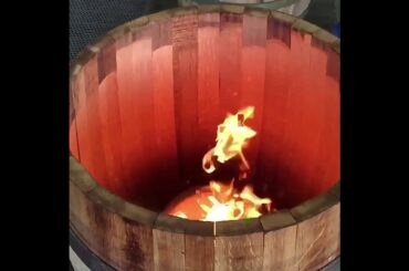 Toasting wine barrel slo-mo at Tonnellerie Cadus in Burgundy, France.