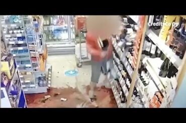 An angry woman wrecked the wine display at a supermarket after being