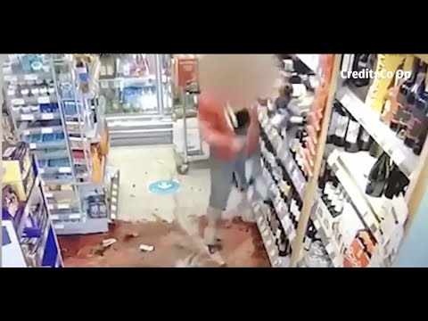 An angry woman wrecked the wine display at a supermarket after being An angry woman wrecked the wine display at a supermarket after being