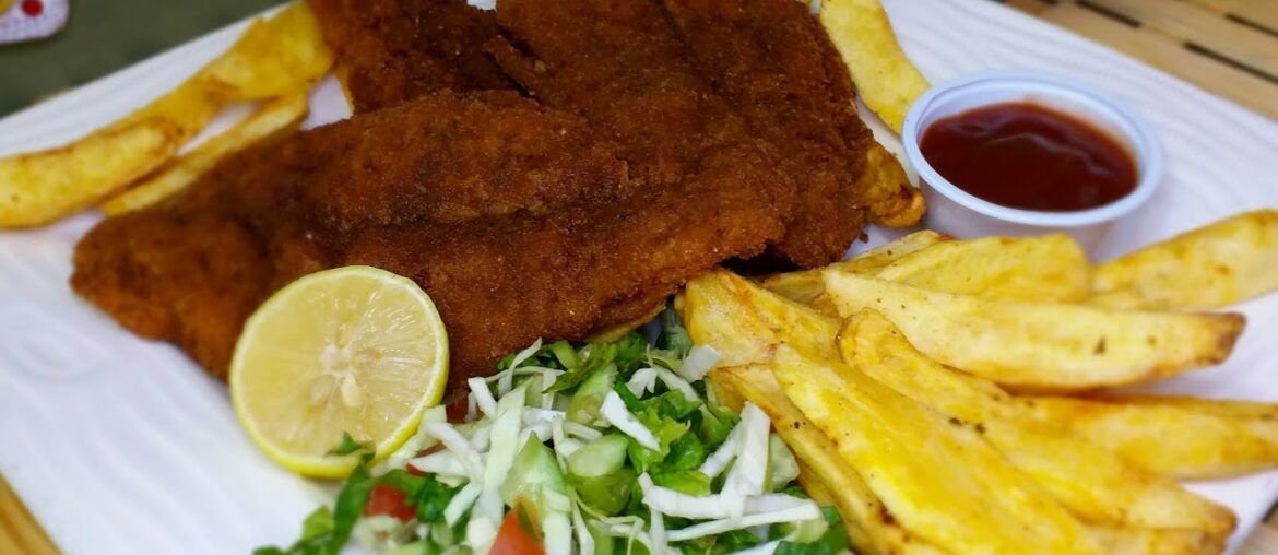 spicy fish fried with crispy potatoes by fatima's dining table.