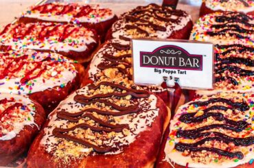 This donut shop has tasty gourmet french toast doughnuts. Reveal & Review.