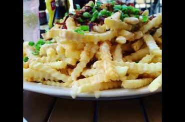 #Shorts - GIGANTIC SIZE OF  LOADED FRIES // Disney springs dining
