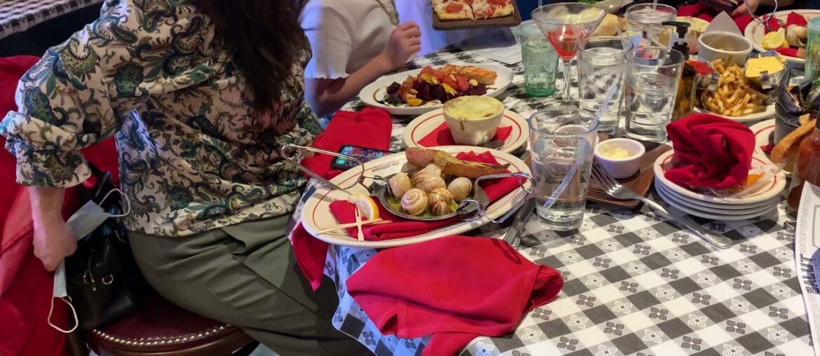 Family eating dinner at French restaurant call salut