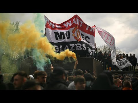 Man United game postponed after fans storm stadium in protest Man United game postponed after fans storm stadium in protest
