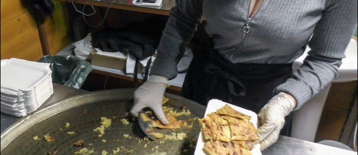 France Street Food. Preparing Socca, Pancake of Chickpea Flour. Seen in Nice