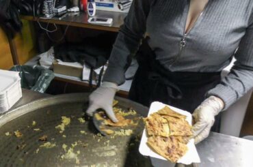 France Street Food. Preparing Socca, Pancake of Chickpea Flour. Seen in Nice