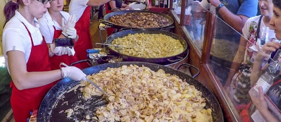 Huge Pans Cooking the Best France Food. Street Food Fair in Italy