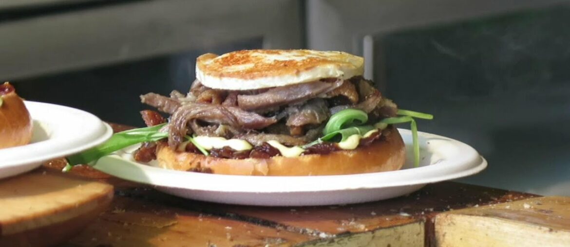 French Food in the Streets of London. The Cooking of the Duck Meat Confit Burger