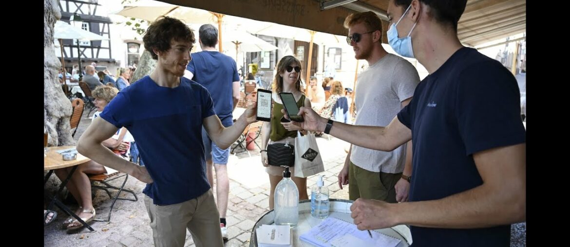 Despite weeks of protests France implements health pass at cafes and