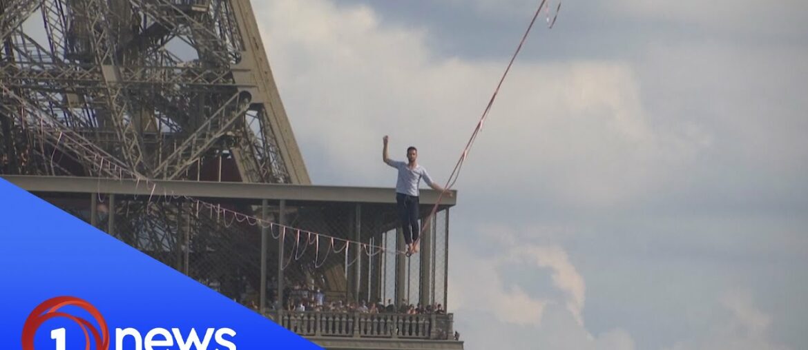 French daredevil stuns crowd with Eiffel Tower highwire act French daredevil stuns crowd with Eiffel Tower highwire act