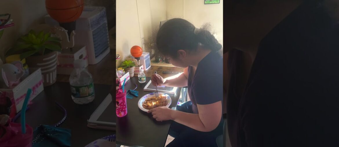 Emily is eating a French toast listening to music and drinking a sprite