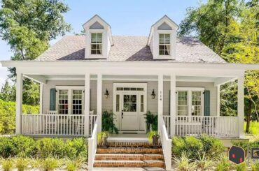 Southern living white cottage features an open airy floor plan and lots of natural light