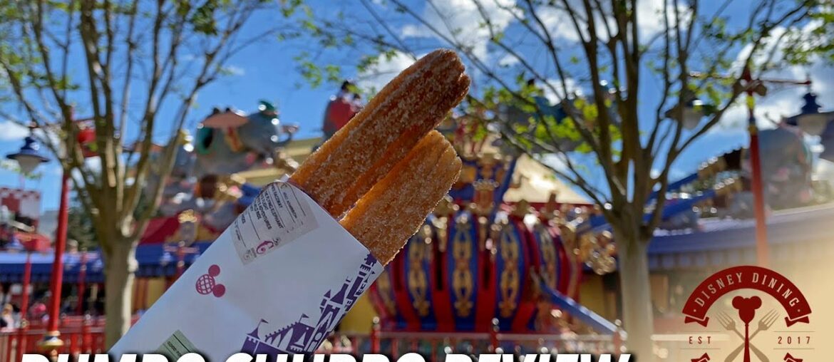 Snacking on the Peanut Butter Dusted Dumbo Churro at Magic Kingdom Snacking on the Peanut Butter Dusted Dumbo Churro at Magic Kingdom