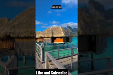 Posh bungalows & villas in an upmarket seaside resort with elegant open-air dining, a spa & a pool.