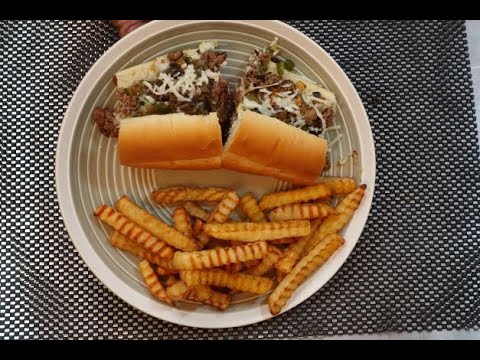 Cheesesteak sandwiches with peppers, onions and mushrooms Cheesesteak sandwiches with peppers, onions and mushrooms