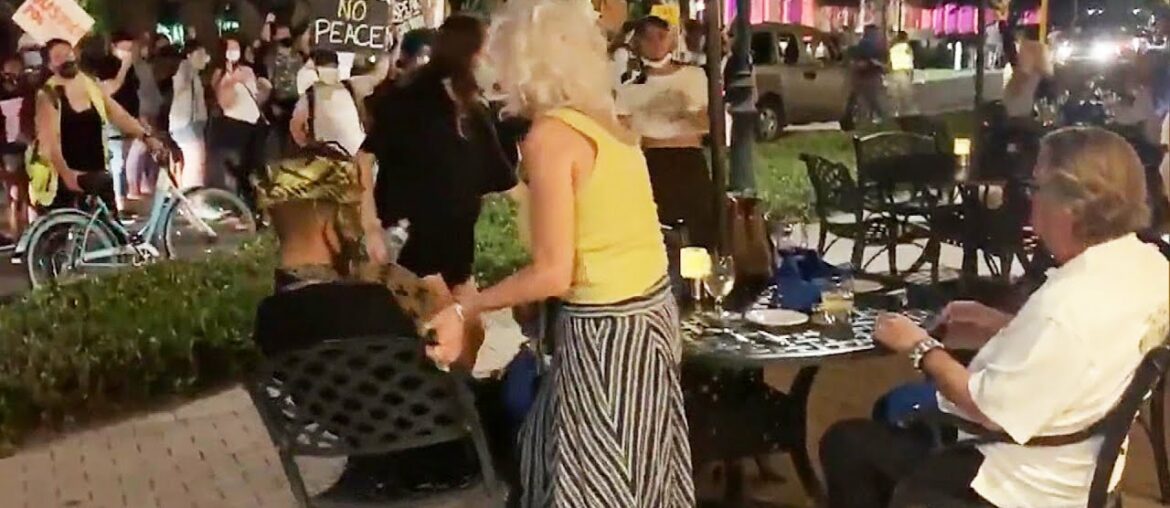 Couple Dining Outside Is Confronted by Protesters Couple Dining Outside Is Confronted by Protesters