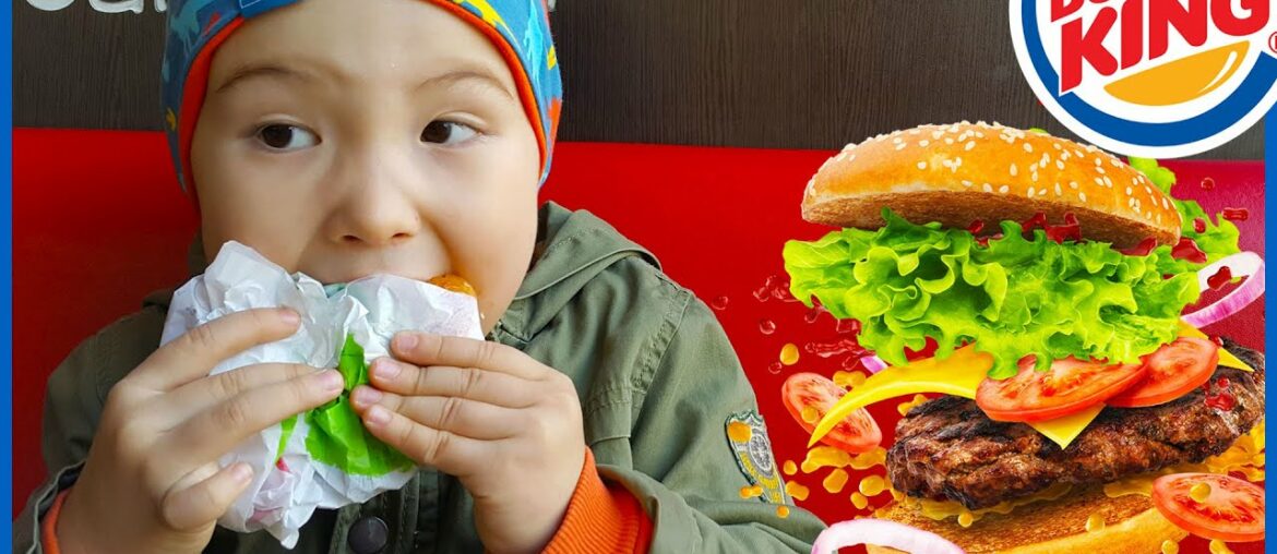 Basaksehir, Istanbul. Eating burger with orange juice, outdoor fast food cafe. Kids videos for kids.