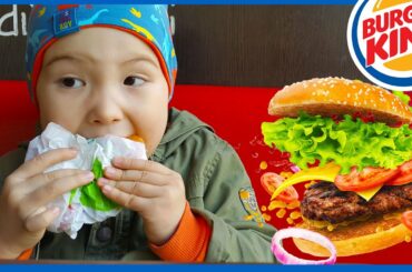 Basaksehir, Istanbul. Eating burger with orange juice, outdoor fast food cafe. Kids videos for kids.