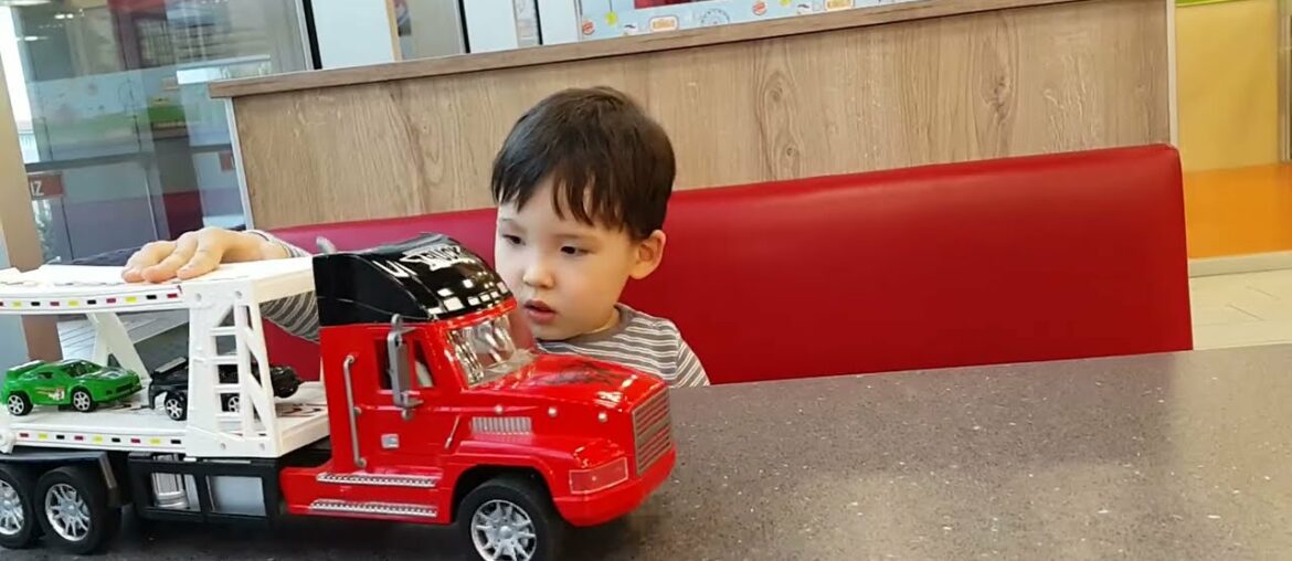 Happy funny little child playing with lots of toy cars indoor Burger King in Istanbul. #burgerking