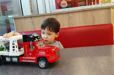 Happy funny little child playing with lots of toy cars indoor Burger King in Istanbul. #burgerking
