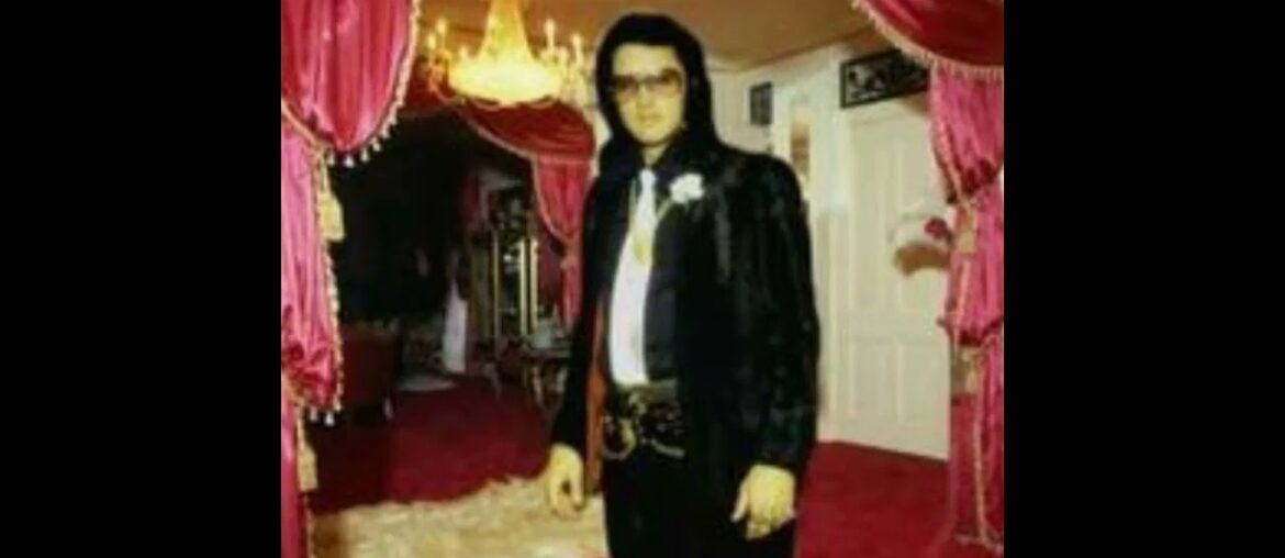 Elvis Standing By The Dining Room ,Foyer Area Of Graceland.Notice The Red Decor.