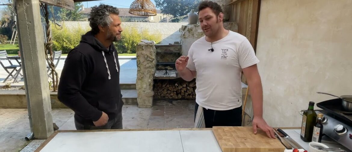 Cooking outdoors to pair wines in France with ex Rugby players.