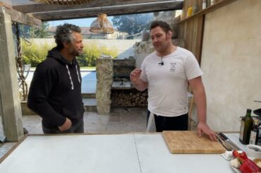 Cooking outdoors to pair wines in France with ex Rugby players.