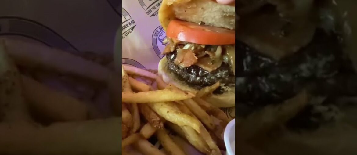 Juicy burger with over the top toppings n french fries n mango chutney