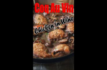 Coq au vin, a French stew of chicken braised in red wine with mushrooms.