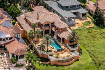 $4,750,000! Magnificent lakefront Italian estate with a stunning infinity pool in Montverde, FL