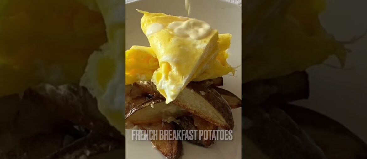 French Omelette and Breakfast Potatoes topped with Mornay Sauce.