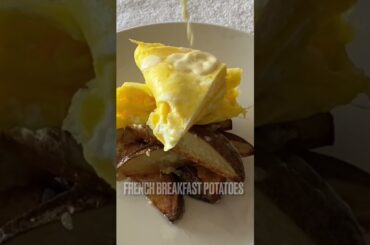 French Omelette and Breakfast Potatoes topped with Mornay Sauce.