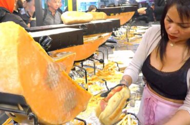 France Street Food. Waterfall of Raclette Melted Cheese & Ham for Sandiwches. Street Food in Italy